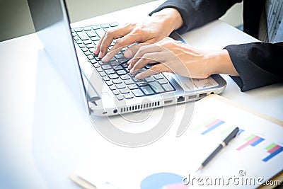 Asia business woman analyzing investment charts on desk. Stock Photo