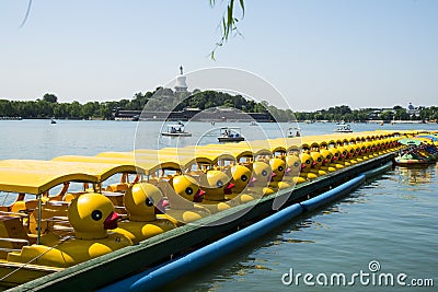 Asia China, Beijing, Beihai Park,Lake view, yellow duck boat Editorial Stock Photo