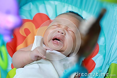 Asia Chinese adorable cute toddler baby boy son child have fun innocent careless childhood pure play games toy cry sneeze Stock Photo