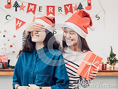 Asia girl lovers couple,girlfriend close eye to surprise friend Stock Photo