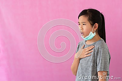 Asia little girl wearing hygienic mask to prevent the virus, PM2.5, Coronavirus, 2019-nCoV. Stock Photo