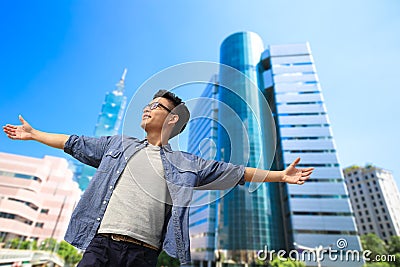 Asia man feel free in the taipei city Stock Photo