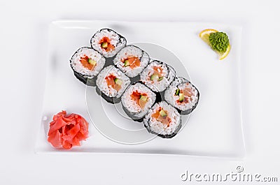 Asia. Rolls with salmon red fish on a white plate on a white b Stock Photo