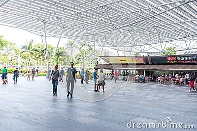 South East Asia / Singapore - Nov 23, 2019 : Pubic event spaces crowded with Asian people entering the mall Editorial Stock Photo