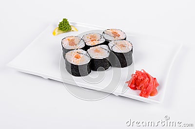 Asia. Spicy rolls with salmon red fish on a white plate on a w Stock Photo