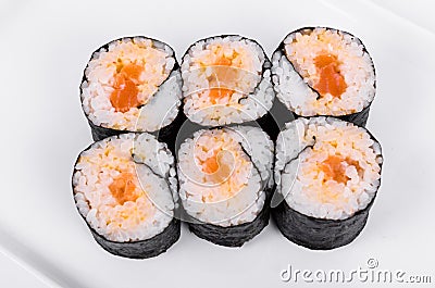 Asia. Spicy rolls with salmon red fish on a white plate on a w Stock Photo