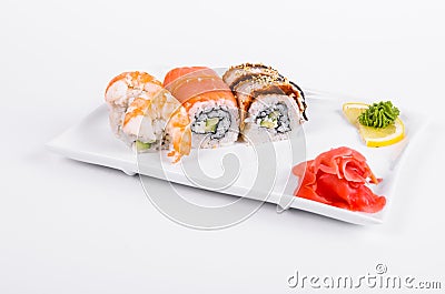 Asia. Tokyo rolls with shrimp, eel and salmon on a white plate o Stock Photo