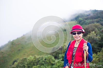 Asia trekker woman in red Stock Photo