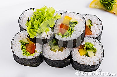 Asia. Vegetarian vegetable rolls on a white plate on a white background Stock Photo