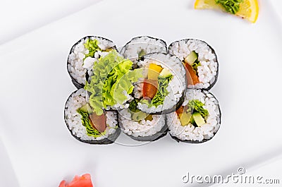 Asia. Vegetarian vegetable rolls on a white plate on a white background Stock Photo