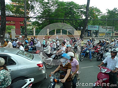 Asia Vietnam ho chi minh city road congestion chaos motorcyclist motorbike motorcycle scooters traffic jam busy intersection Editorial Stock Photo