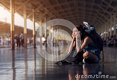 Asia woman with bag backpack and sitting bored wait a time for t Stock Photo