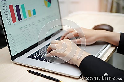 Asian accountant type keyboard to enter information, working, calculate and analyzing report Stock Photo