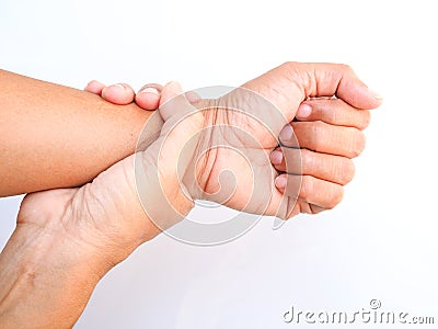 Asian adult suffering from wrist pain, hand touch on arm and massage on wrist to relieve, body part isolated on white Stock Photo