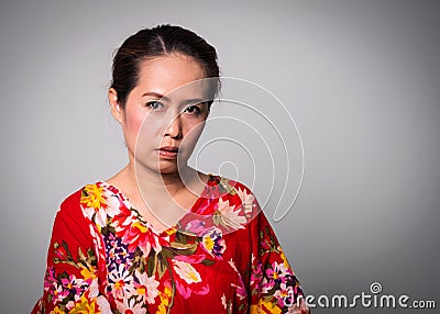 Asian adult woman straight face on white background Stock Photo