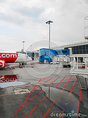 An Asian Airlines passenger airliner parked outside the airport terminal Editorial Stock Photo