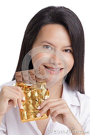 Asian American woman enjoying a Milk Chololate candy bar Stock Photo