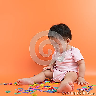 Asian baby with wooden alphabets Stock Photo