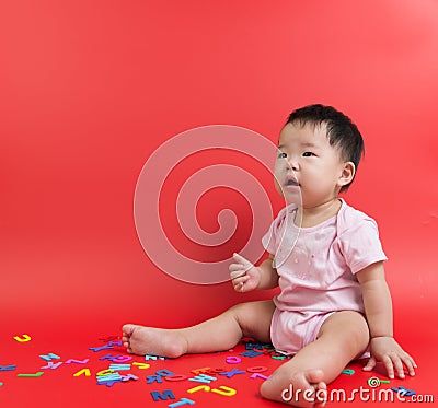 Asian baby with wooden alphabets Stock Photo