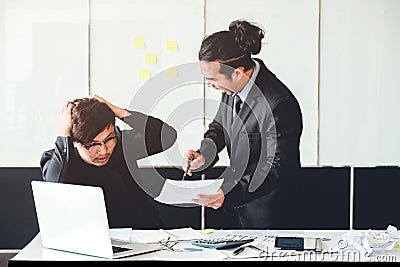 Asian Bad angry boss yelling at business man sad depressed employee reprimand from team leader missed deadline concept Stock Photo