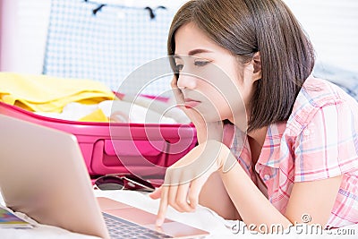 Use laptop to plan for trip Stock Photo