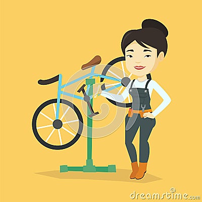 Asian bicycle mechanic working in repair shop. Vector Illustration