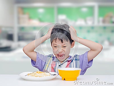 Child don`t want to eat food for lunch Stock Photo