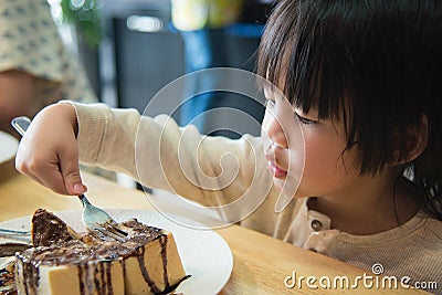 Asian boy eating honey toast Stock Photo