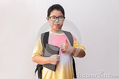 Asian boy elementary school with book and bag. Back to school. education concept Stock Photo