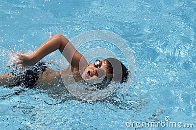 Asian boy front crawl swims in swimming pool Stock Photo