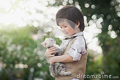 Asian boy holding american short hair kitten Stock Photo