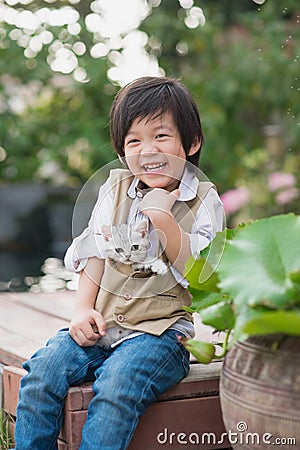 Asian boy holding american short hair kitten Stock Photo