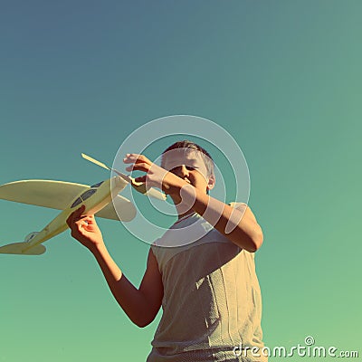 Asian boy running airplane model - vintage retro style Stock Photo