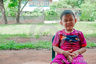 Asian boy smiles. See teeth that decay. the concept of dental and oral health of children and toothpaste Stock Photo