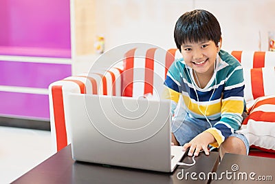 Asian boy using Laptop computer for online study homeschooling during home quarantine. homeschooling, online study, home Stock Photo