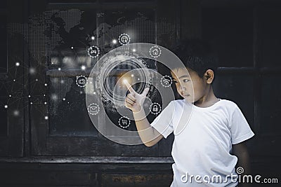 Asian boy wearing a white t-shirt Standing with your fingers touching the buttons of modern technology. Stock Photo
