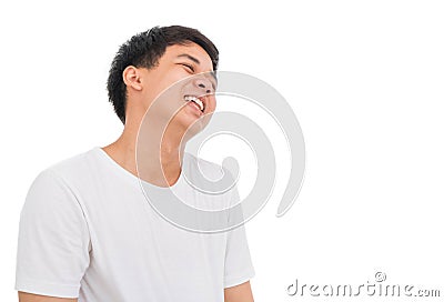 An Asian boy in white shirt with black hair is laughing to the c Stock Photo