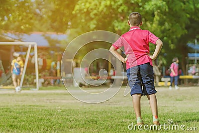 Asian boys practice kicking the ball to score goals Editorial Stock Photo