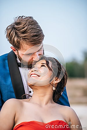 Asian bride and Caucasian groom have romance time and happy Stock Photo