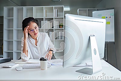 Asian business analyze the situation on the financial report in the work room. Investment Consultant, Financial Stock Photo