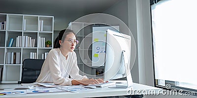 Asian business analyze the situation on the financial report in the work room. Investment Consultant, Financial Stock Photo