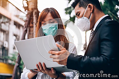 Business People Working at Outdoor Location ,They `re Wearing Protective Mask to Prevent Flu and Corona Virus Covid-19 Outbreak Stock Photo