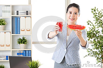 Asian business woman know concentrate fruit juice is not fresh Stock Photo