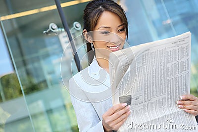 Asian Business Woman Reading Newspaper Stock Photo