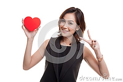 Asian business woman show victory sign with red heart. Stock Photo