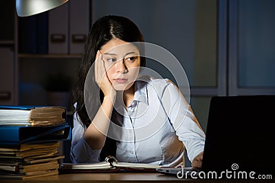 Asian business woman sleepy working overtime late night Stock Photo