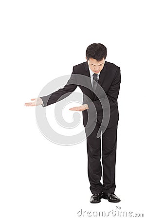 Asian businessman with bow and welcome gesture Stock Photo