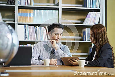 Asian businesspeople meeting discussing business in office Stock Photo