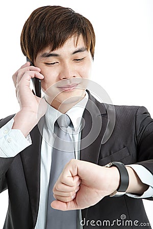 Asian businessman checking time Stock Photo