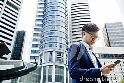 Asian businessman in a city Stock Photo